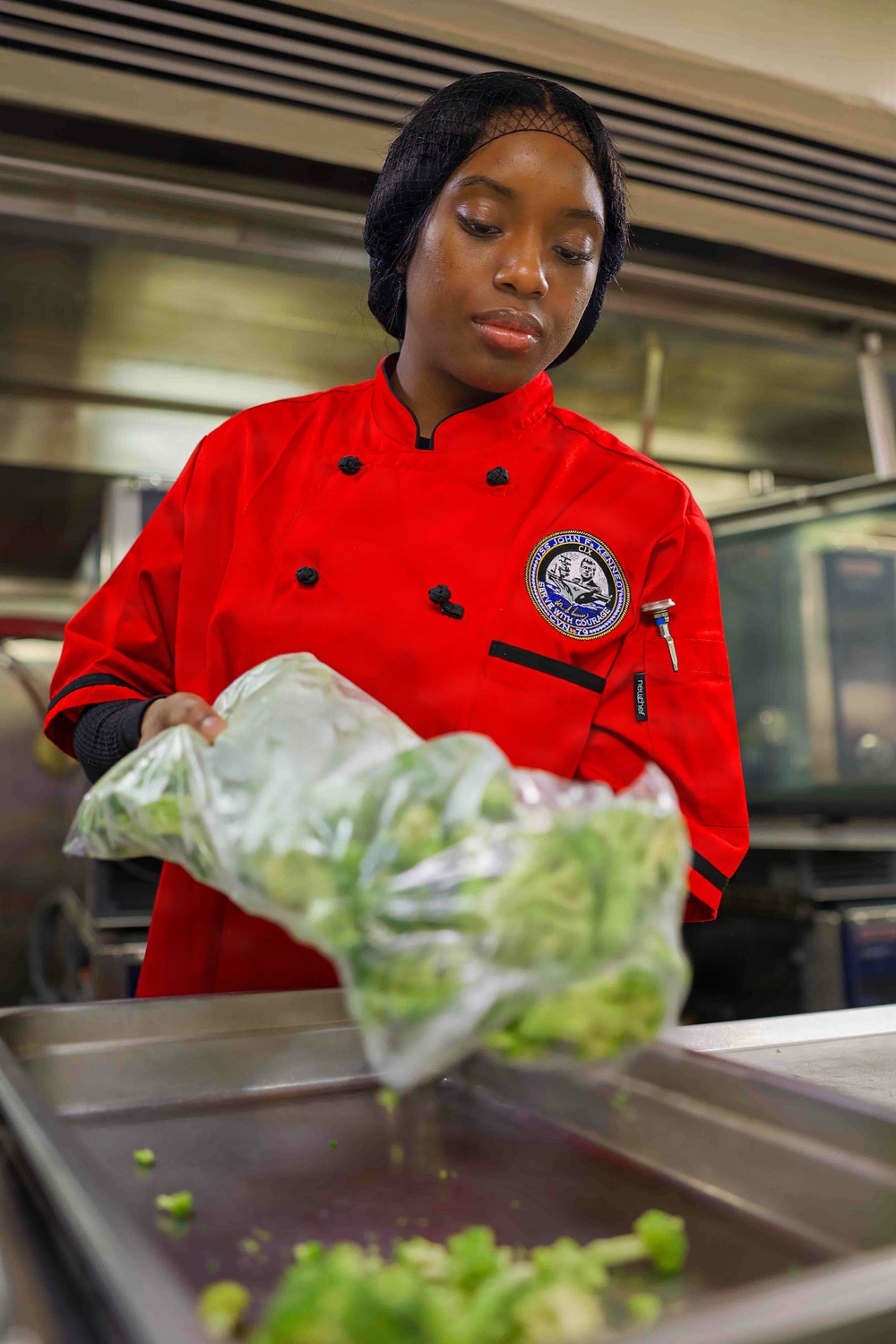 PCU John F. Kennedy Sailor Prepares Lunch