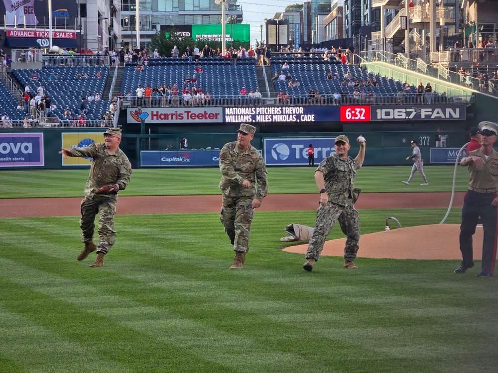Military leaders throw ceremonial first pitch