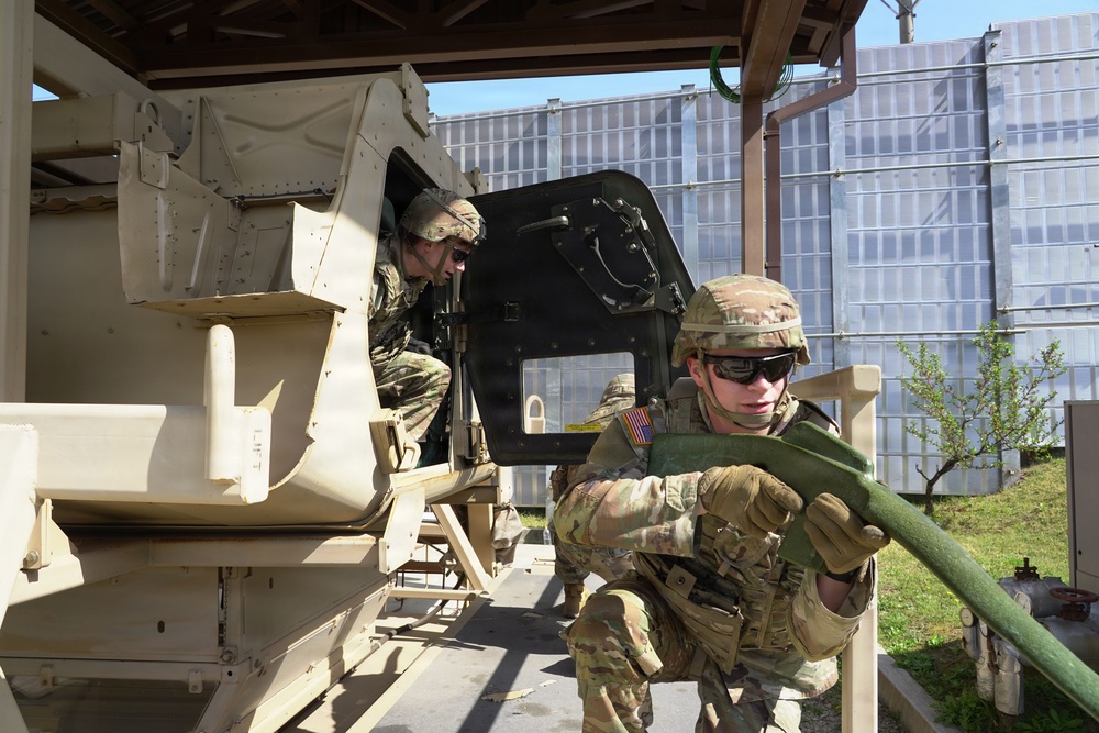 Soldiers exit the vehicle and secure the scene during training