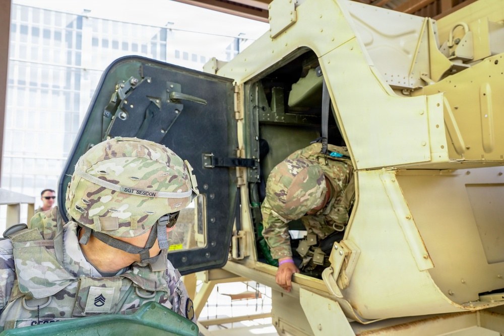 Soldiers clear the vehicle and pull security during training