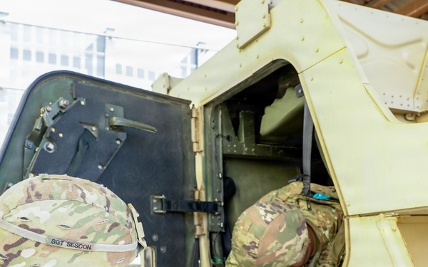 Soldiers clear the vehicle and pull security during training