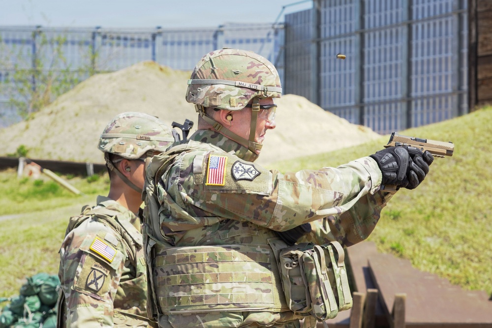 Soldiers engage targets with M17 pistols during live-fire qualification