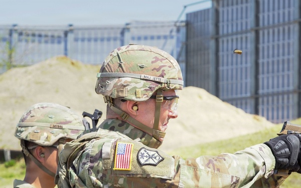 Soldiers engage targets with M17 pistols during live-fire qualification