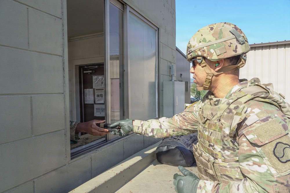 Soldiers receive a range brief before stepping onto the firing line