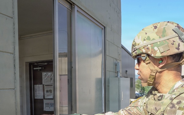 Soldiers receive a range brief before stepping onto the firing line