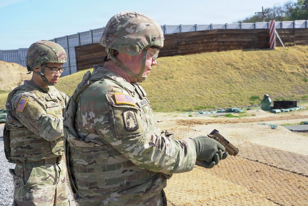 Soldier conducts M17 pistol functions check during qualification at Carroll Range