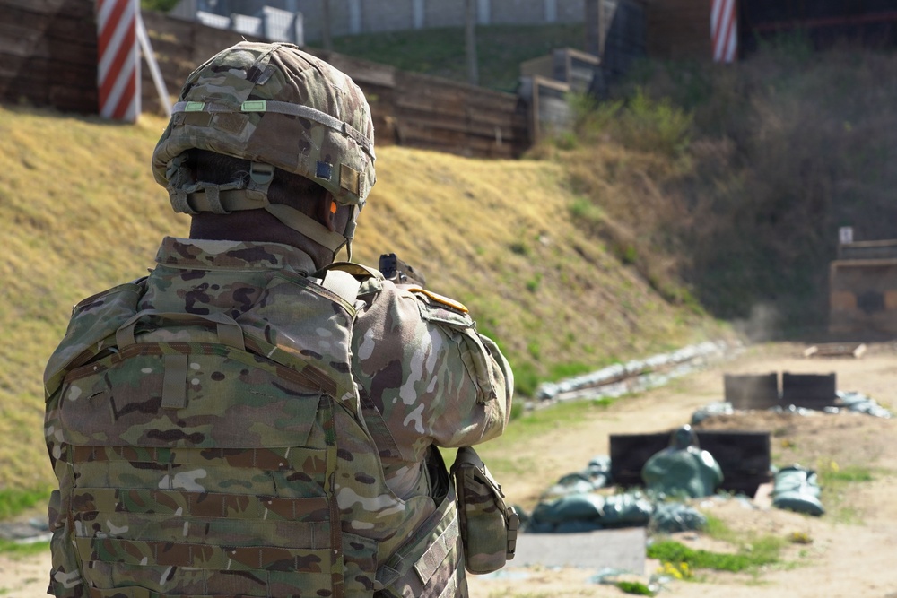 Senior leadership conducts range qualifications with the M17