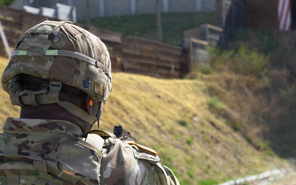 Senior leadership conducts range qualifications with the M17