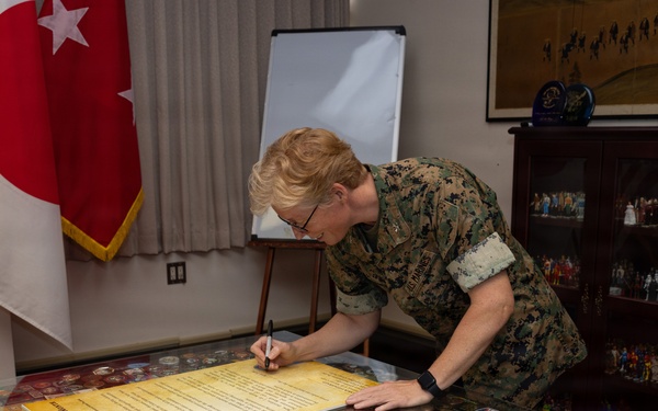 Col. Karin Fitzgerald signs the Child Abuse Prevention Month Proclamation