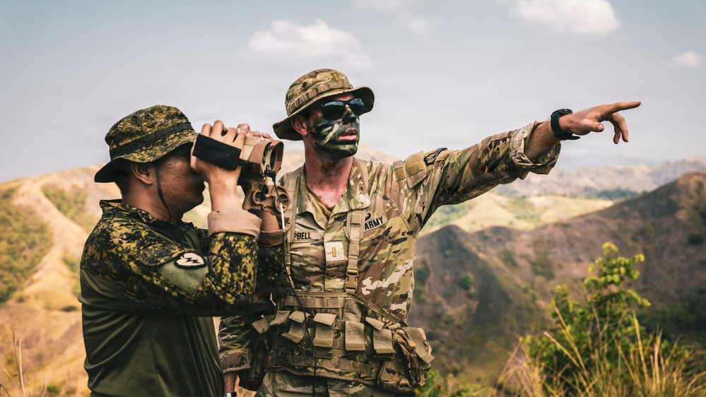 U.S. Army Fire Support Team observes HIMARS live fire