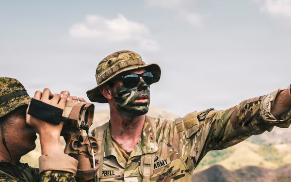U.S. Army Fire Support Team observes HIMARS live fire