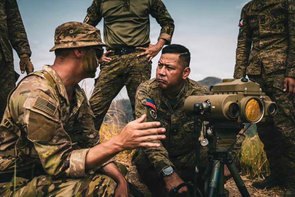 U.S. Army Fire Support Team observes HIMARS live fire