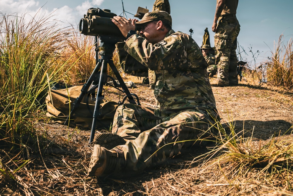 U.S. Army Fire Support Team observes HIMARS live fire