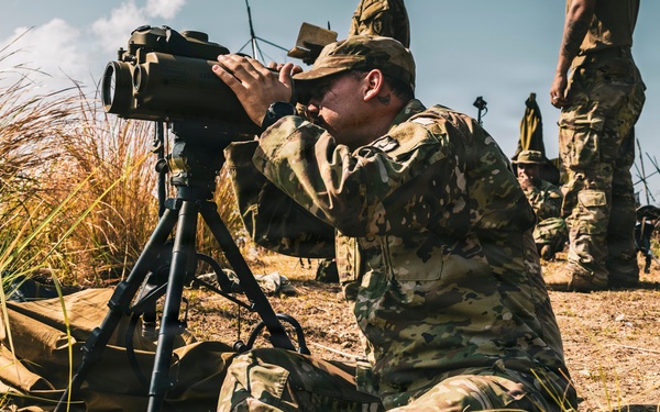 U.S. Army Fire Support Team observes HIMARS live fire