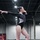 DoWEA Lejeune High School junior performs on the balance beam during a gymnastics competition