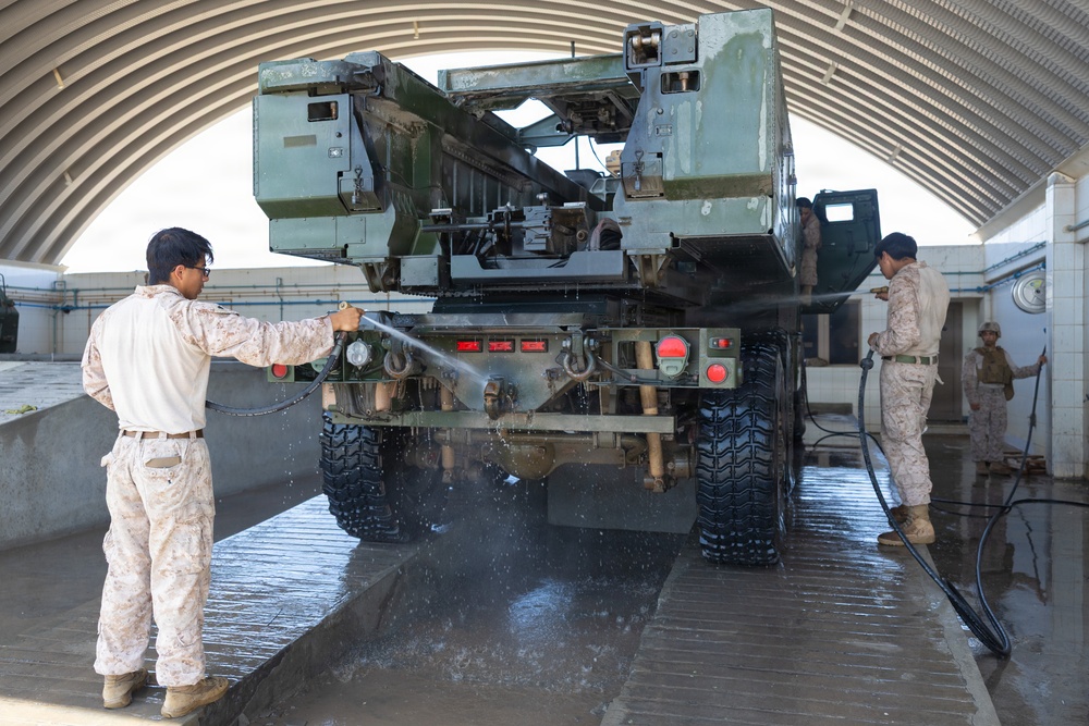 U.S. Marines with Echo 2/10 clean M142 HIMARS