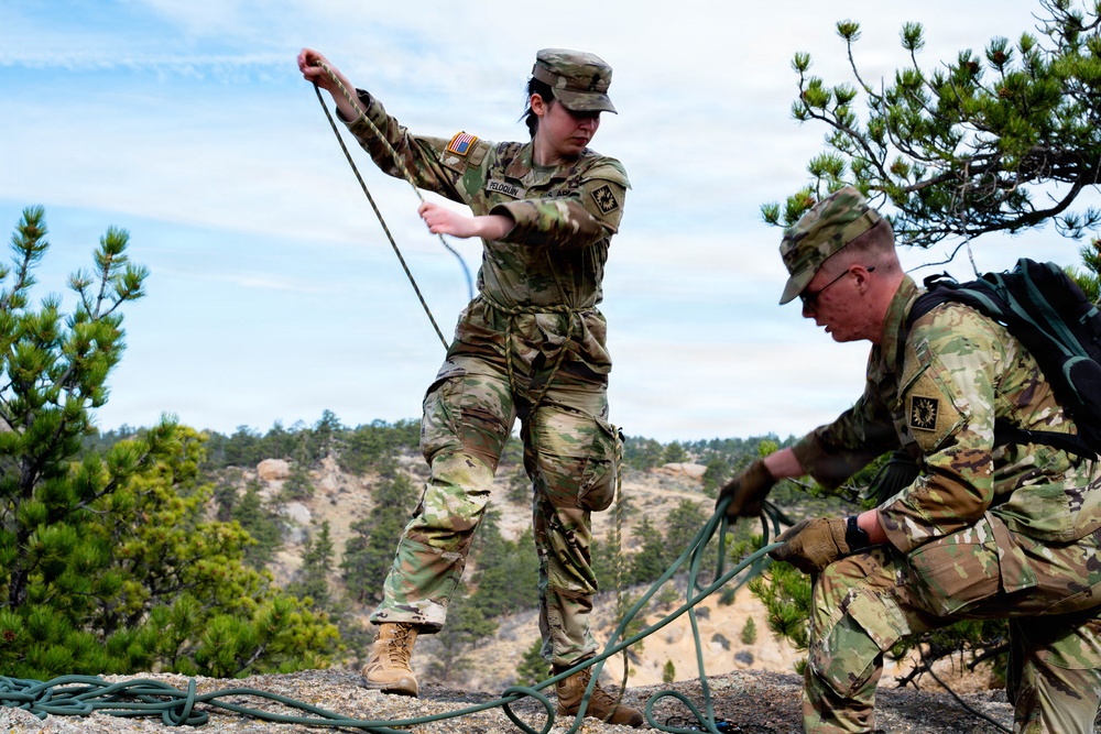 Medics prepare rope techniques for moving casualty