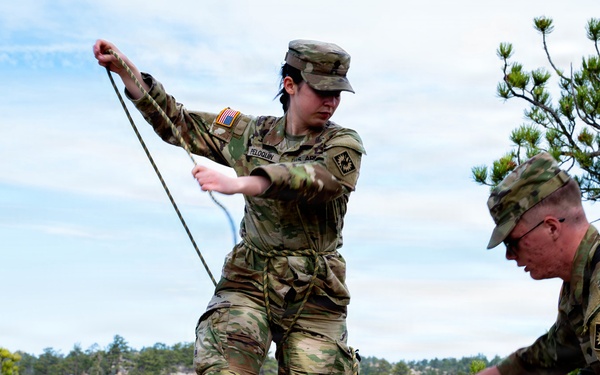Medics prepare rope techniques for moving casualty