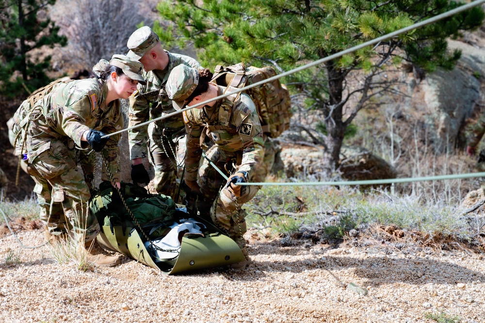 Medics maneuver casualty across terrain