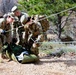 Medics maneuver casualty across terrain