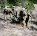 Medics maneuver casualty across terrain