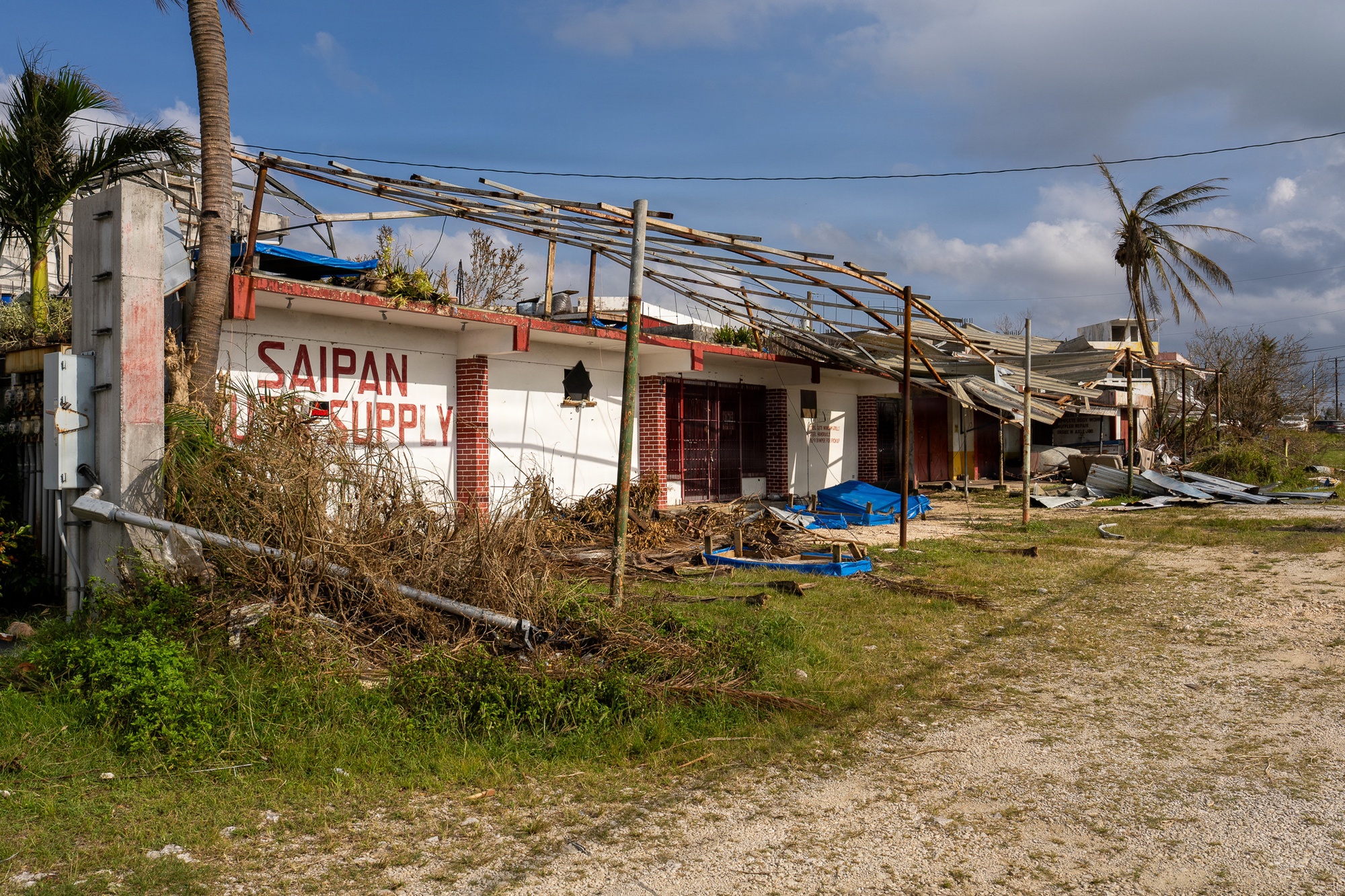 Damage and debris from Super Typhoon Sinlaku on Saipan, CNMI, April 20, 2026. Photo by Dominick Del Vecchio, DVIDS (public domain).