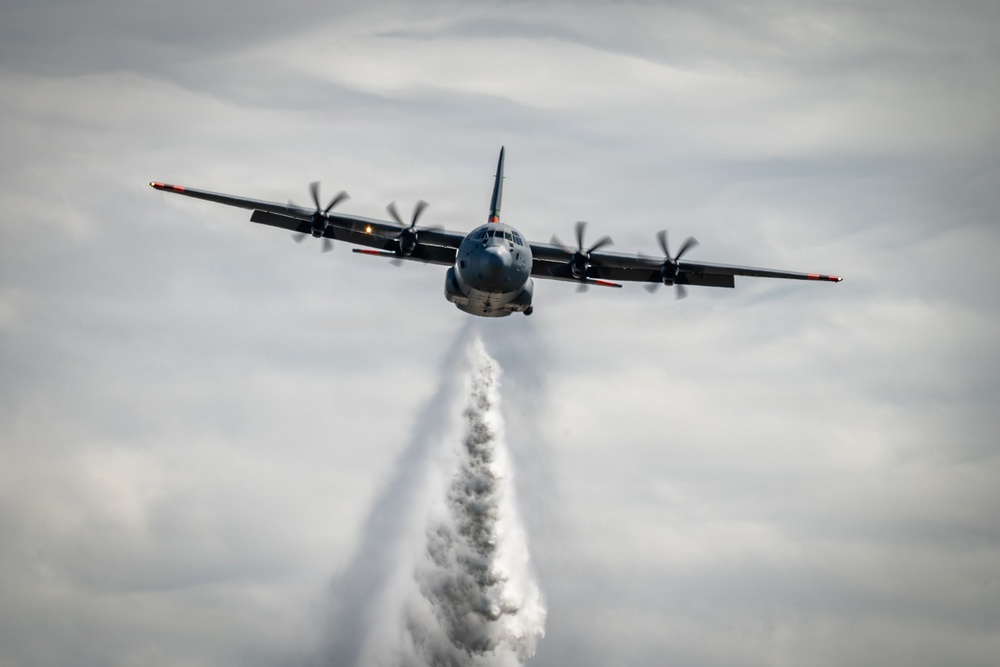 C-130 Drops Water Plume