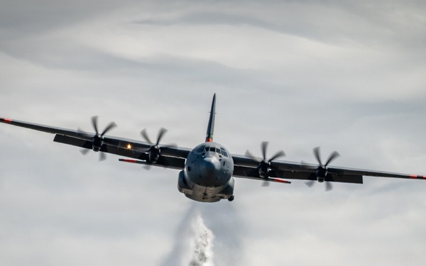 C-130 Drops Water Plume
