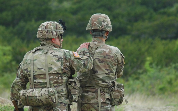 Reserve NCO Mentors Soldier During Weapons Qualification