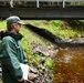 Fisheries biologist monitors a karst stream on the Tongass
