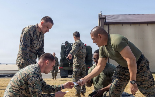 U.S. Marines provide medical care during a simulated mass casualty training event