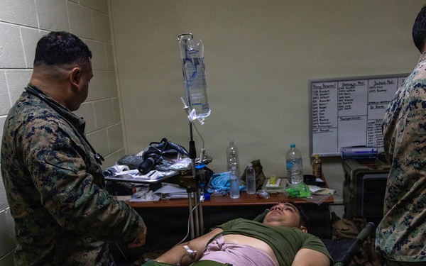 U.S. Marines provide medical care during a simulated mass casualty training event
