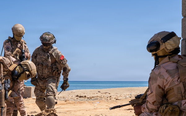 Multinational forces assault shoreline objective during Flintlock 2026