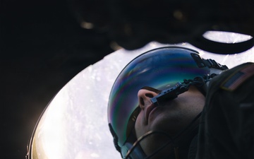 180th Airlift Squadron airmen fly alongside a MiG-29 fighter jet