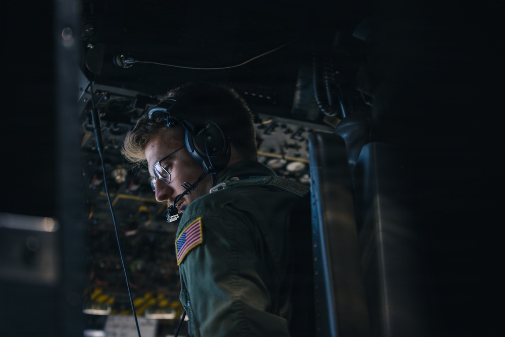 180th Airlift Squadron airmen fly alongside a MiG-29 fighter jet