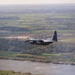 180th Airlift Squadron airmen fly alongside a MiG-29 fighter jet