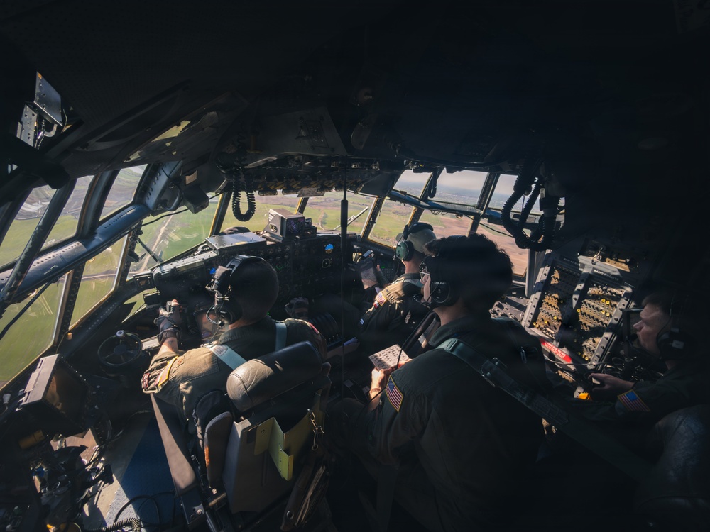 180th Airlift Squadron airmen fly alongside a MiG-29 fighter jet