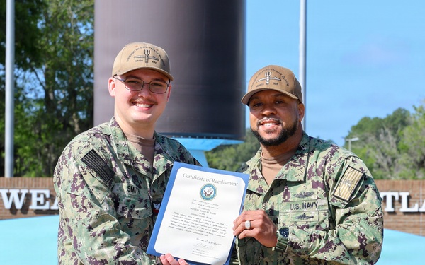 SWFLANT Sailor Reenlists at Missile Display