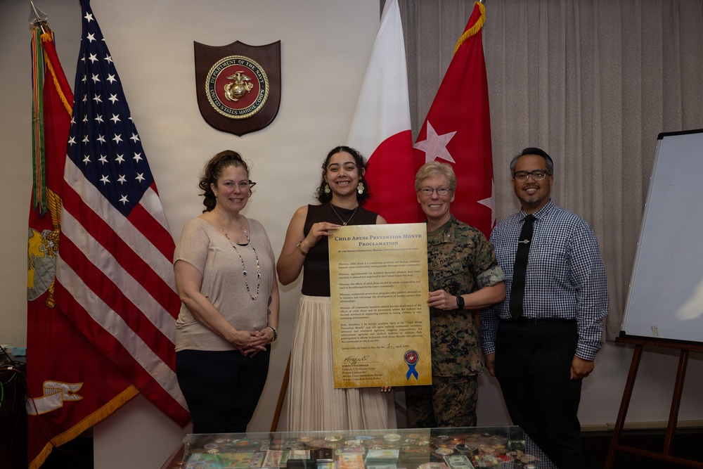 Col. Karin Fitzgerald signs the Child Abuse Prevention Month Proclamation