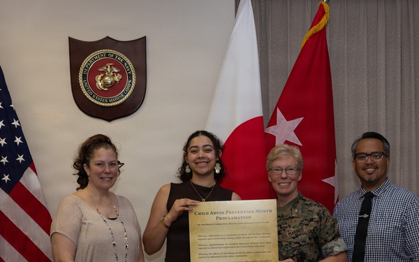 Col. Karin Fitzgerald signs the Child Abuse Prevention Month Proclamation
