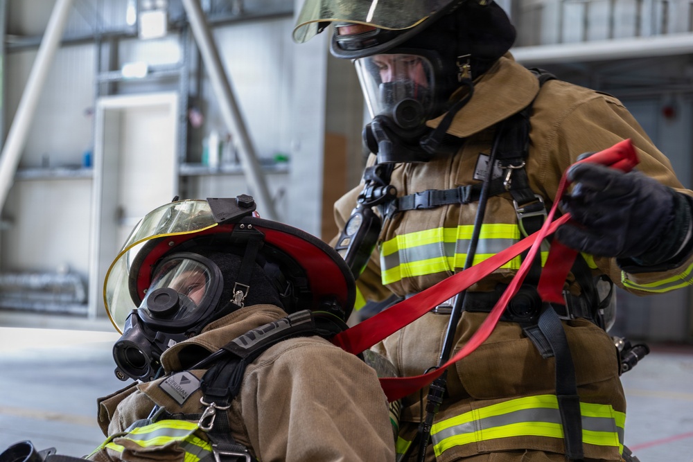U.S. Army Firefighters conduct downed firefighter rescue training