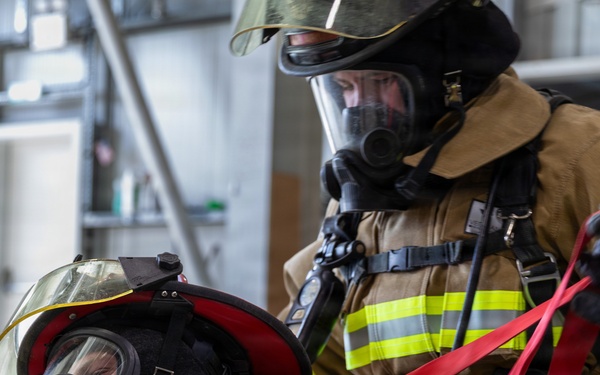 U.S. Army Firefighters conduct downed firefighter rescue training