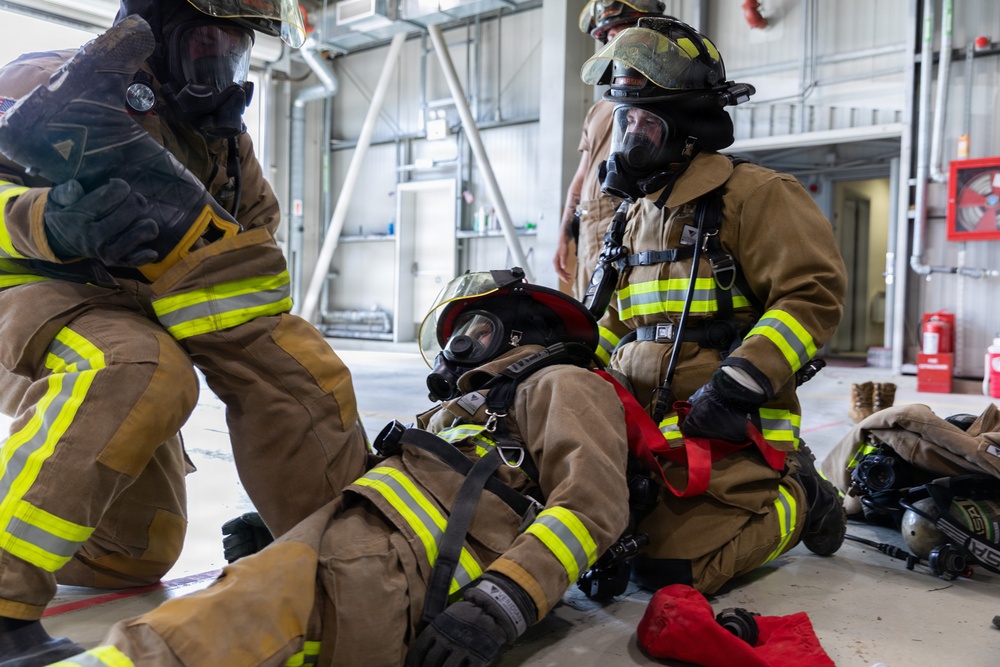 U.S. Army Firefighters conduct downed firefighter rescue training