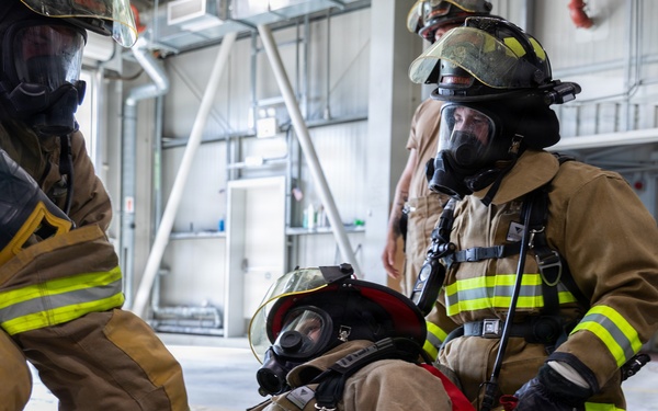 U.S. Army Firefighters conduct downed firefighter rescue training