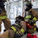 U.S. Army Firefighters conduct downed firefighter rescue training