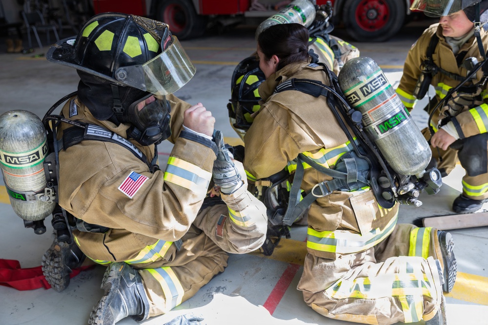 U.S. Army Firefighters conduct downed firefighter rescue training