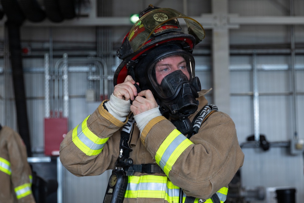 U.S. Army Firefighters conduct downed firefighter rescue training