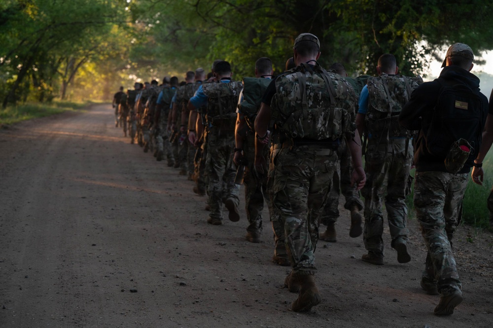 WOTS Class 26-04 Candidates execute week 4 ruck march