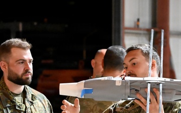 MDC-E Soldiers prepare UAS for test flight at Arcane Thunder 26