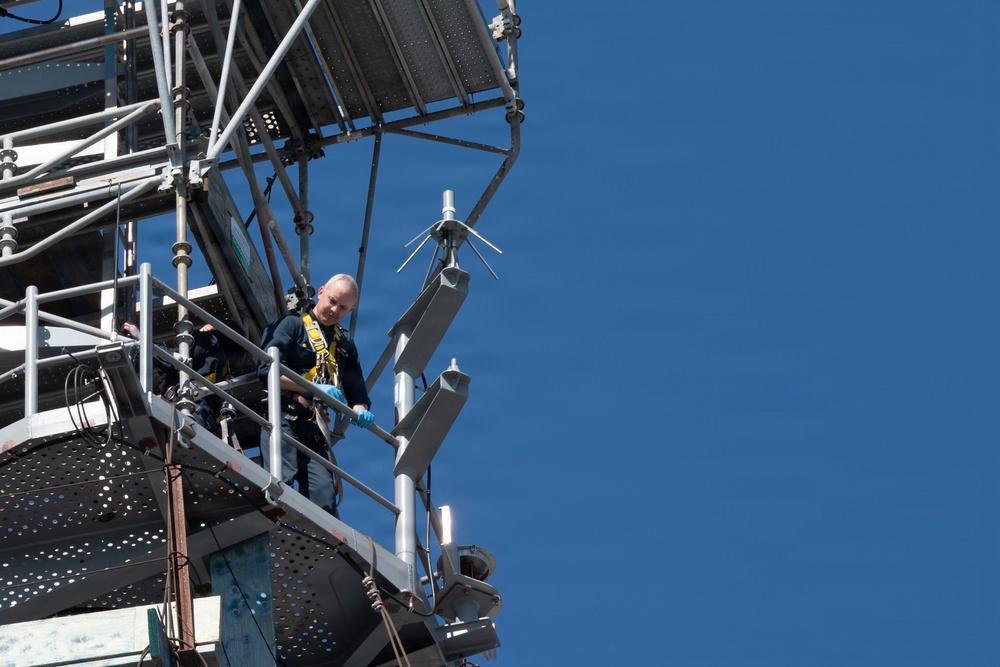 Commanding Officer Capt. Matthew Kiser goes aloft